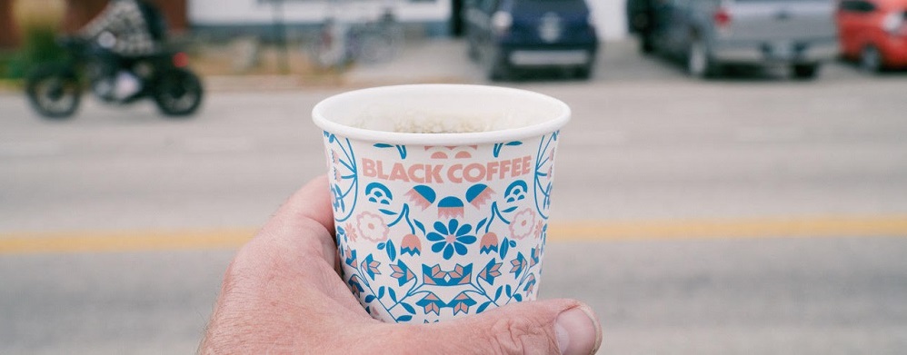 custom-printed-hot-cup-being-held-in-one-hand.jpg