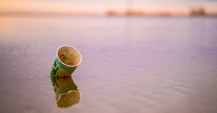 Coffee cup litter floating in ocean